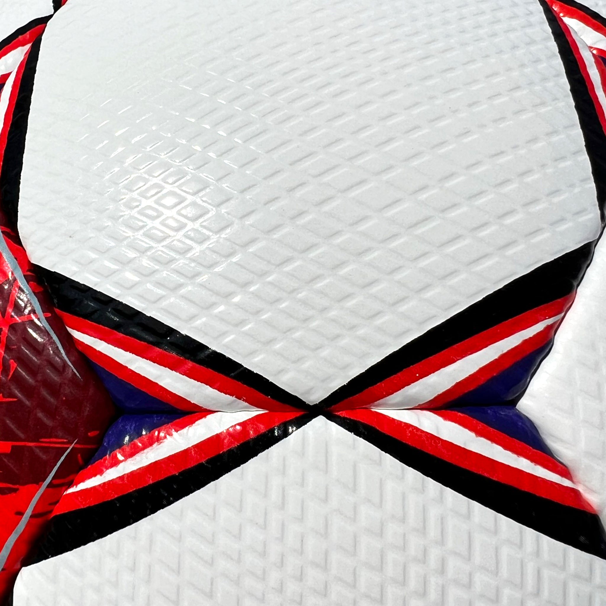 White soccer ball with red, blue, and black accents