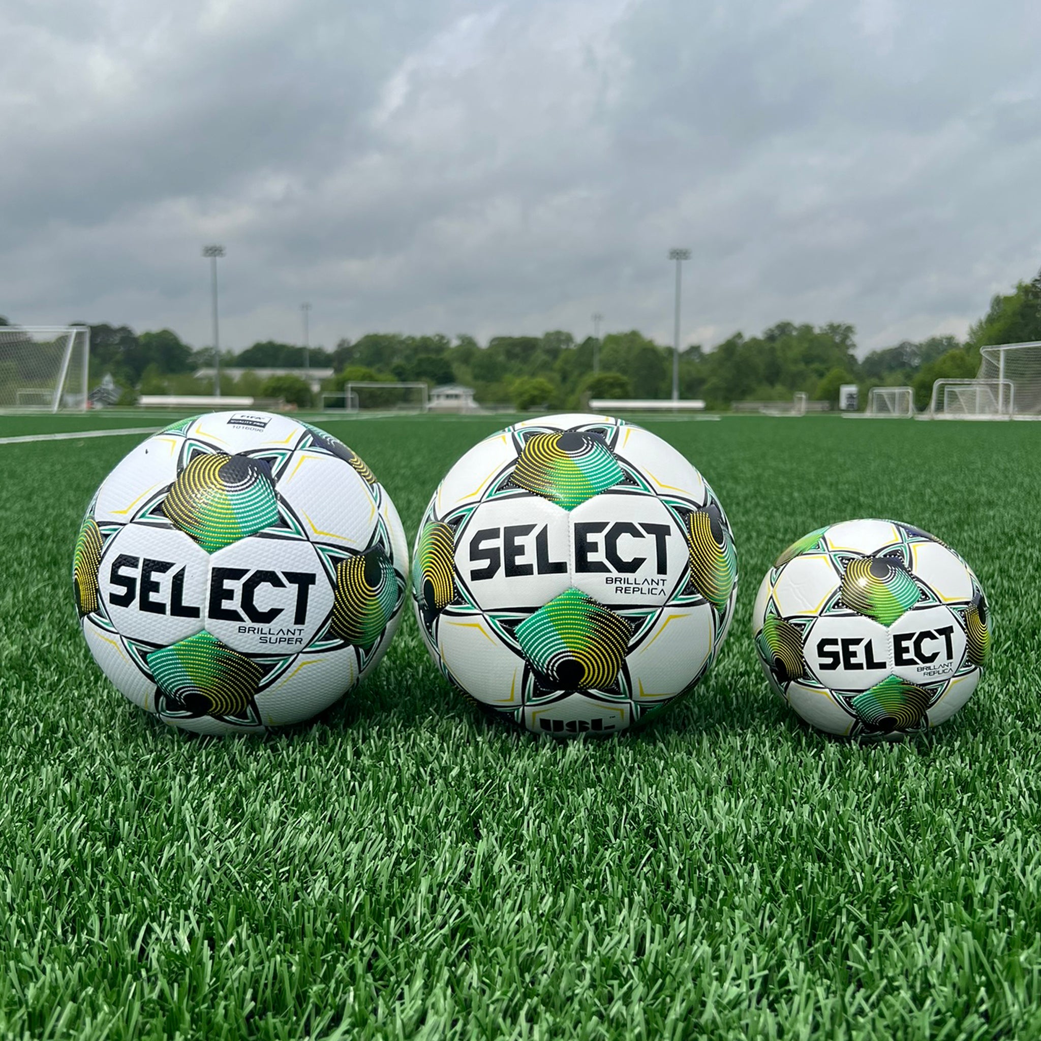 White soccer ball with black pentagons, green and yellow accents and 'Select' branding on a white background. Official replica mini ball of the USL 2025 season #color_white/green